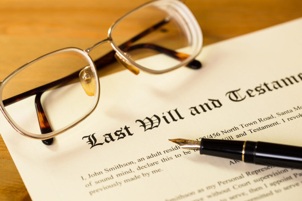 How To Prevent Family Estate Disputes - Last will and testament with pen and glasses concept for legal d
